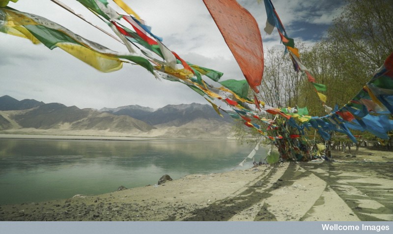 prayer flags on Yarlung Zangbo River, Tibet Exploring Tibet's Secret Temple after work 