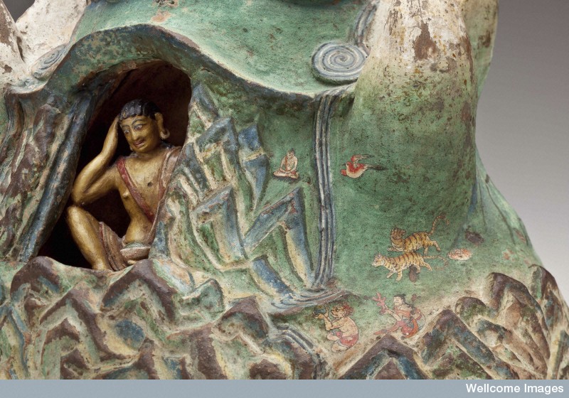 meditating in a mountani statue. Exploring Tibet's Secret Temple after work 