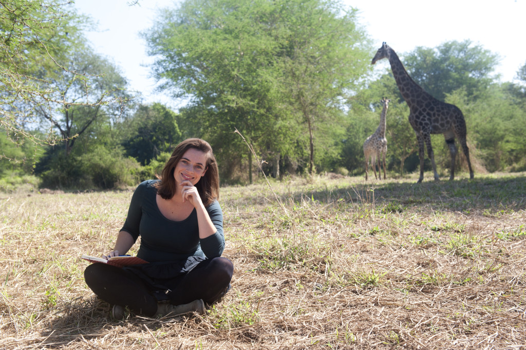 Transformational coach Lucia Labouchere sitting among giraffes in Malawi 
