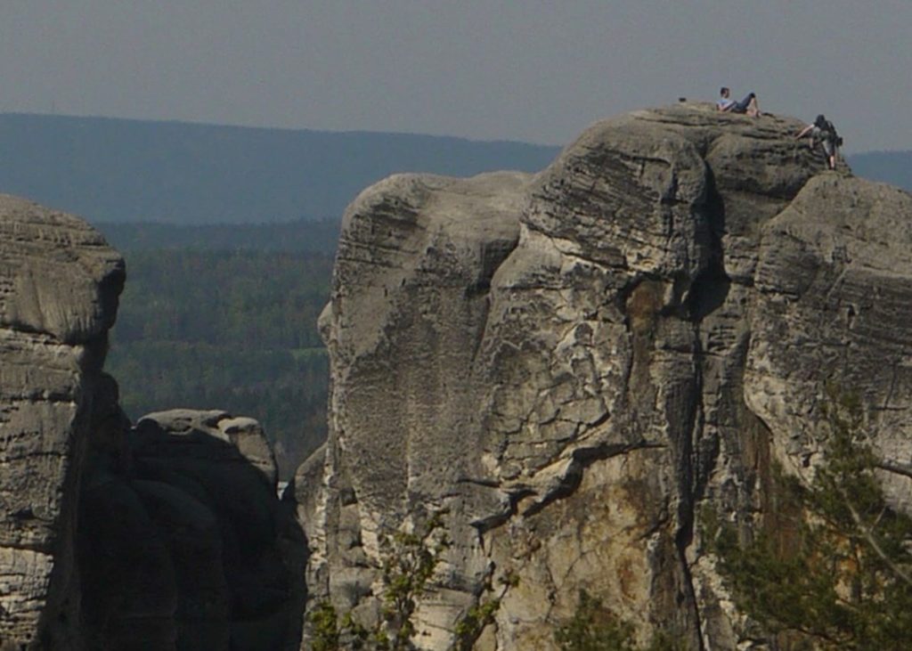 mountaineers on sandstone pillars in the Bohemian Paradise 