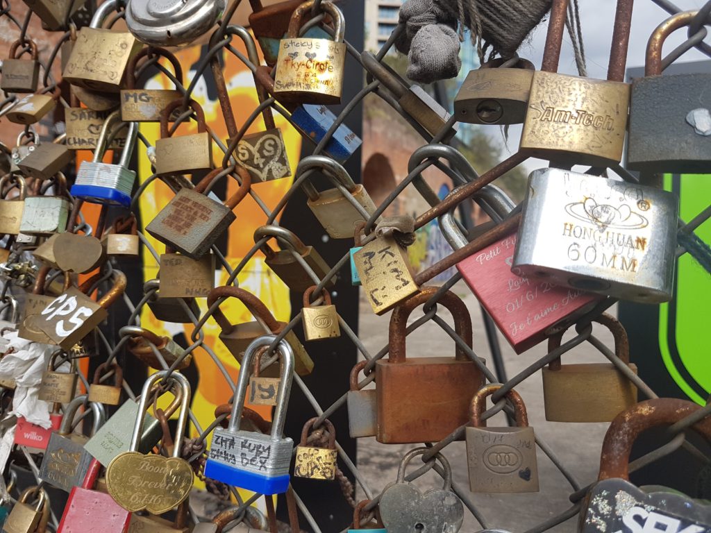 padlocks with couples names hanging on the Shoreditch Love Fence in Shoreditch 