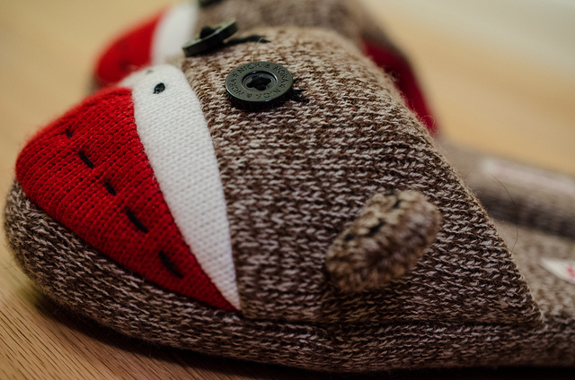 close up of knitted sock monkey slippers