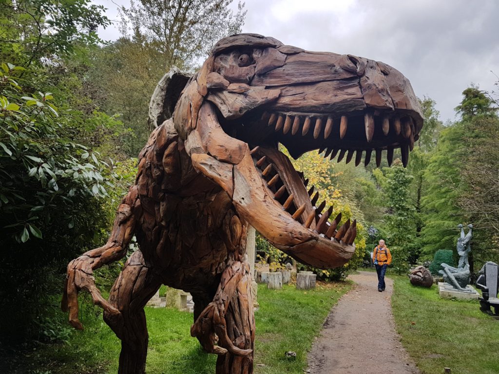 close up of a wooden tyrannosauras sculpture at the sculpture park in Churt, near Farnham 