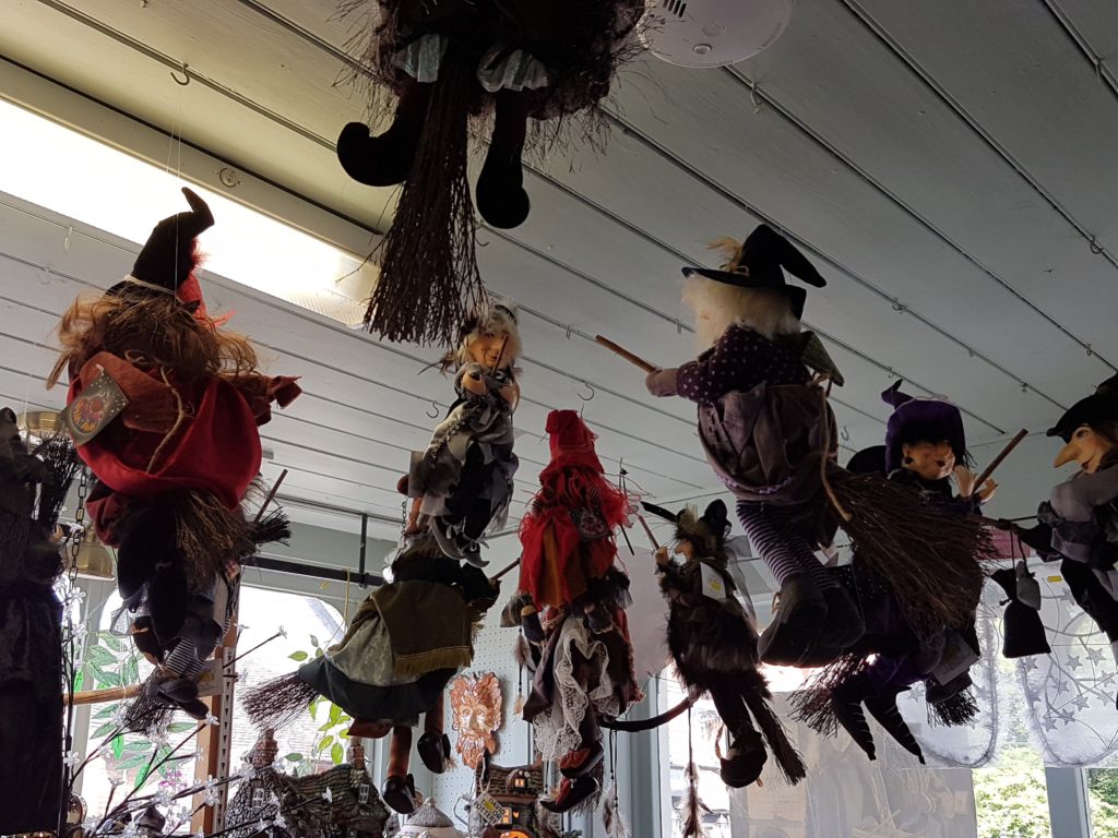 puppet witches suspended from the ceiling 