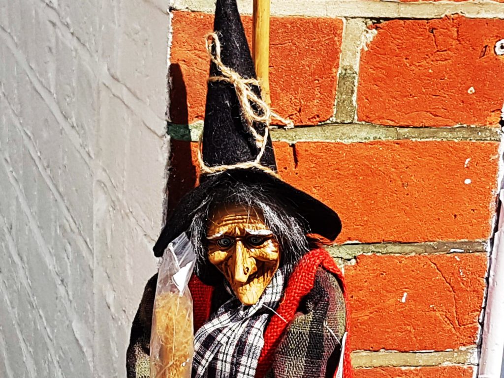 witch doll outside shop in Burley, New Forest 