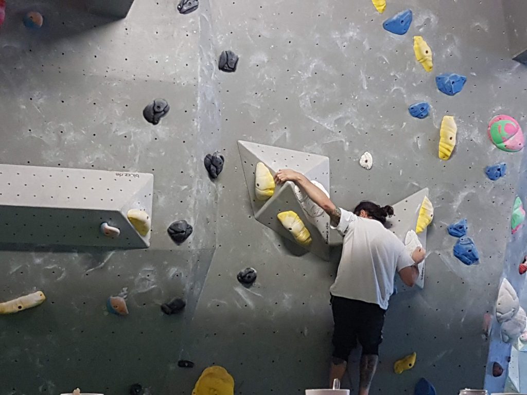 climber moving up the wall at the Arch Climbing Wall in Burnt Oak 
