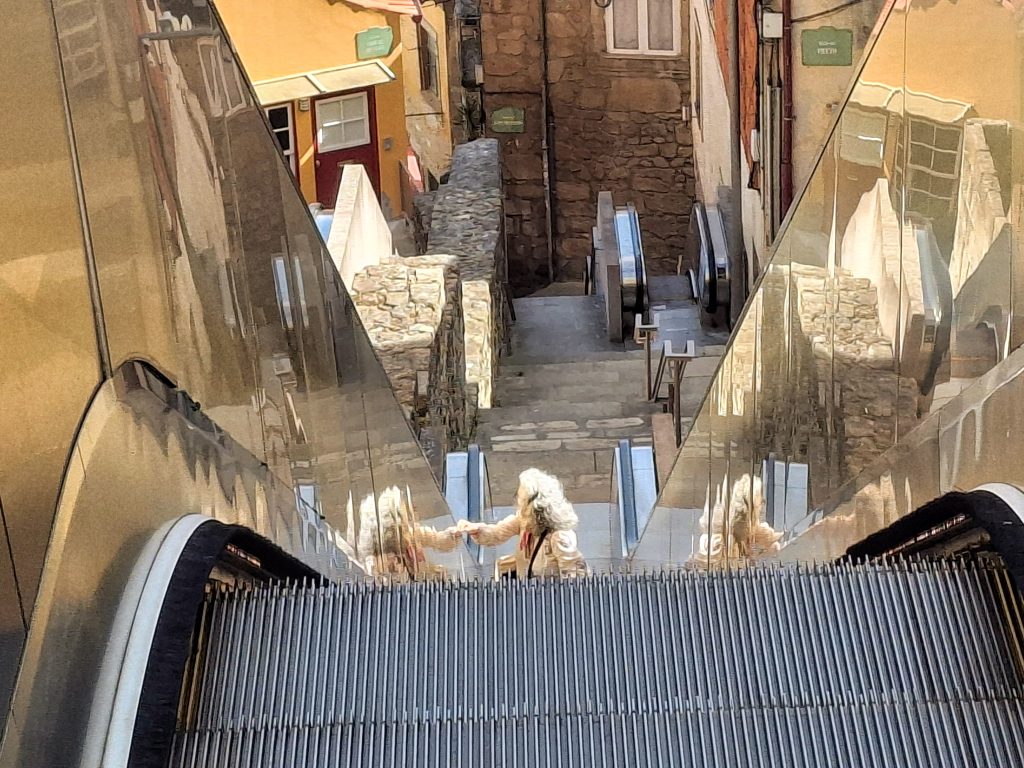 An outdoor shopping centre style escalator in Porto