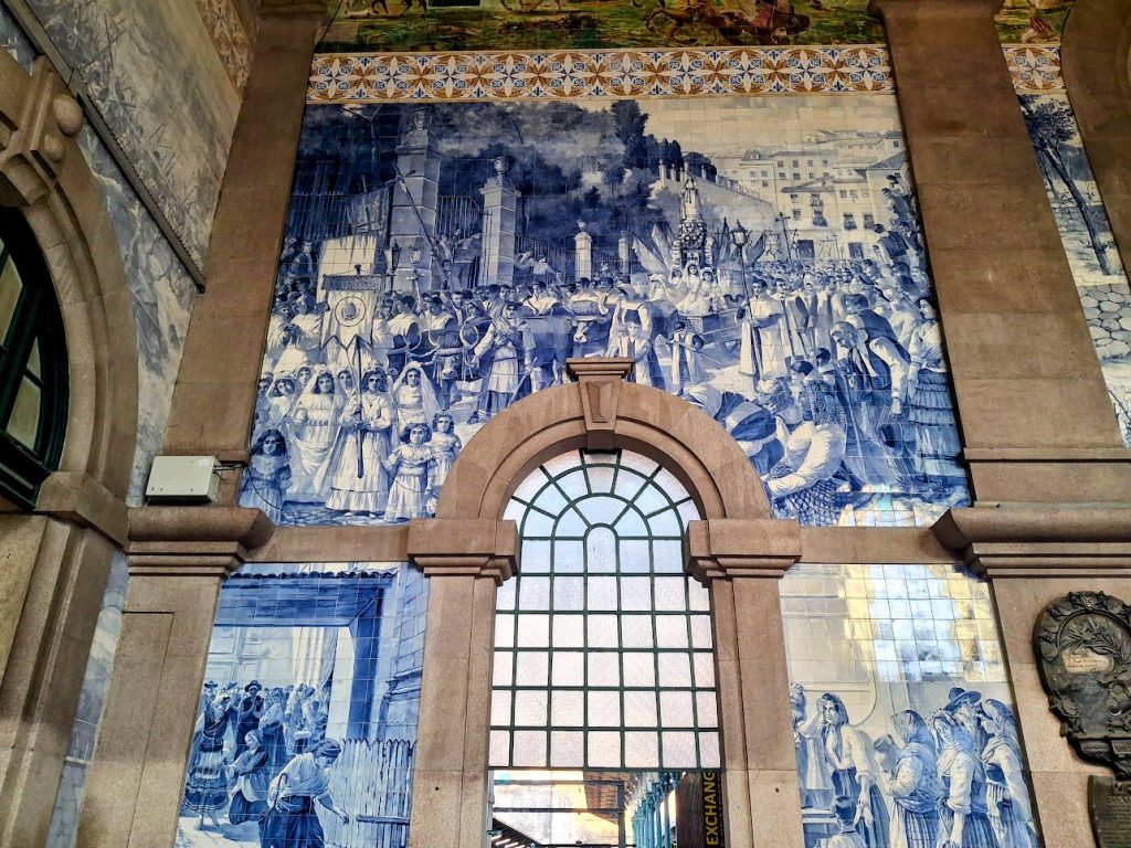 close up of blue and white tiles at Sao Bento train station in Porto.